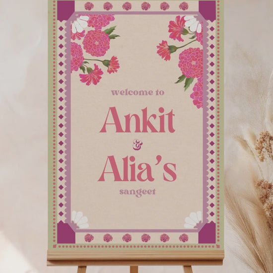 Pink & Purple Retro Wedding Welcome Sign with pink marigold florals. Pastel colours. Indian Wedding events for Sangeet, Haldi, Maiyan or Jago. Wedding Signage. Personalize and customize in Canva. Digital Download.  Print around the world at a local print shop.