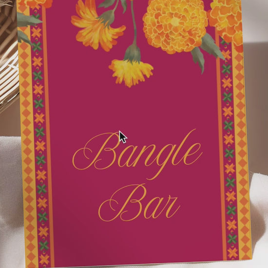 Wedding Stationery Sign with marigold florals in the shades of yellow, orange & green phulkari. Bangle Station, Bindi Bar, Jhumka Bar, Mehndi Station, Chai Station. Personalize and customize in Canva. Print at any local printer around the World.