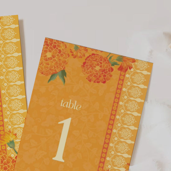 Orange Marigold Floral table numbers. Wedding, engagement, bridal shower, baby shower signage. In the shades of orange, yellow & beige. Indian Wedding Table Decor. Sangeet, Maiyan & Jago, Mehndi, Haldi, Engagement, Birthday, Bridal Shower, Baby Shower. Wedding & event stationery. Personalize & customize in Canva. Digital Download. Print around the world at a local print shop.